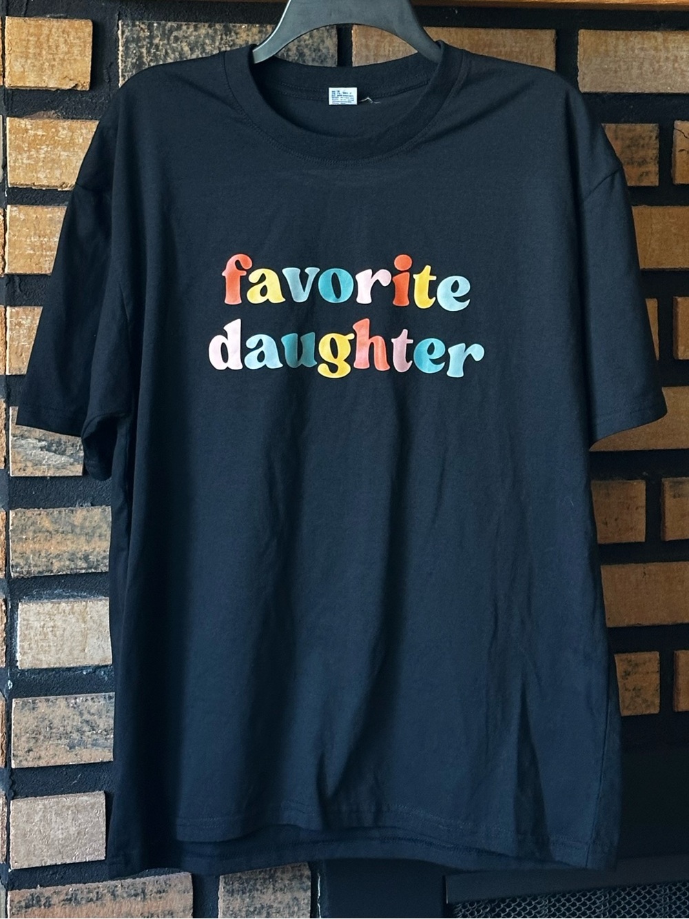 Women’s “Favorite Daughter” Black Graphic Tee